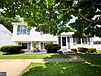 A house with a lawn and a walkway

Description automatically generated