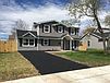 A house with a driveway

Description automatically generated